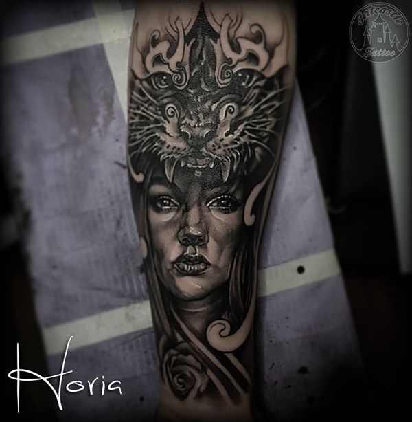 ArtCastleTattoo Tattoo ArtiestHoria Realistic Womans portrait tattoo with tiger lower arm Black n Grey