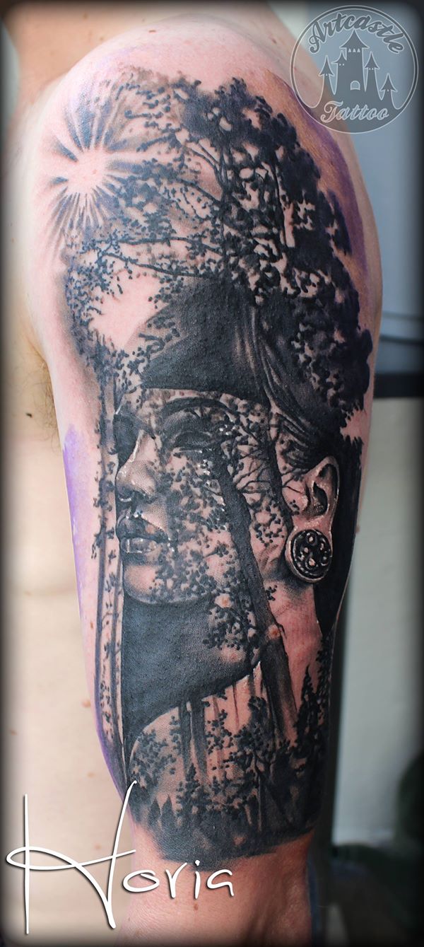 ArtCastleTattoo Tattoo ArtiestHoria Realistic womans portrait tattoo sunshine through trees black n grey upper arm Portrait