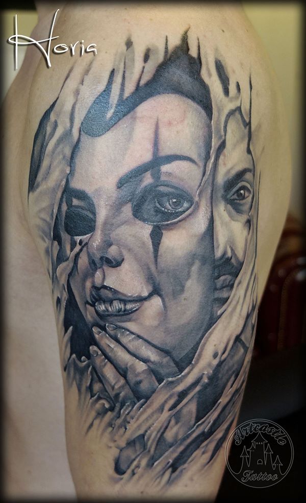 ArtCastleTattoo Tattoo ArtiestHoria Relaistic man portrait with a Mask with ripped Flesh black n grey upper arm Black n Grey