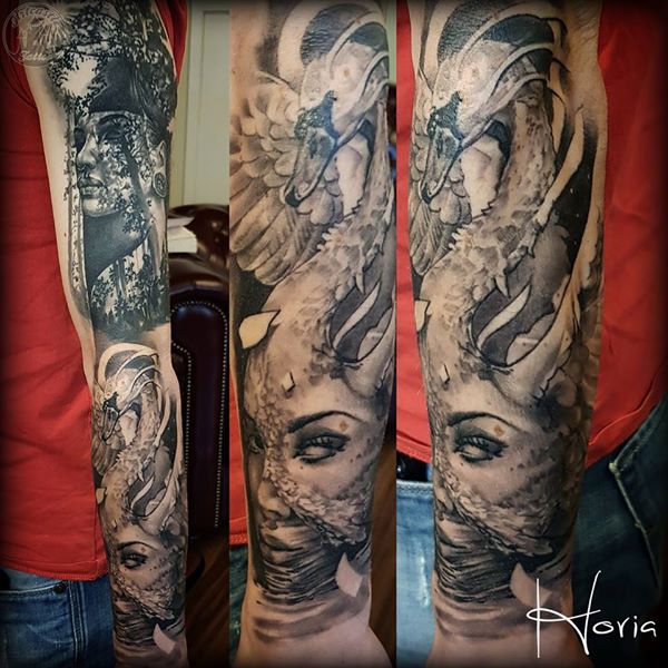 ArtCastleTattoo Tattoo ArtiestHoria Womans face with swan morph in black n grey on lower arm Sleeves