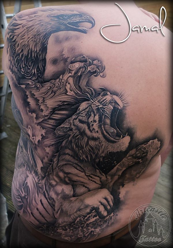ArtCastleTattoo Tattoo ArtiestJamal Backpiece of a realistic tiger splashing out of the water and a eagle flying out of the clouds. BlacknGrey