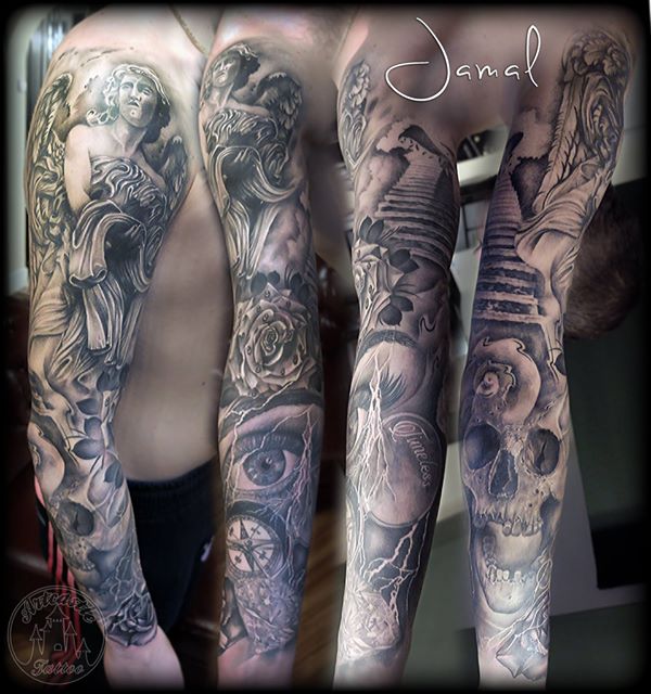 ArtCastleTattoo Tattoo ArtiestJamal Black and grey full sleeve with skulls roses angels a realistic eye compass and a diamond. ALOT ingredients in this tattoo Sleeves