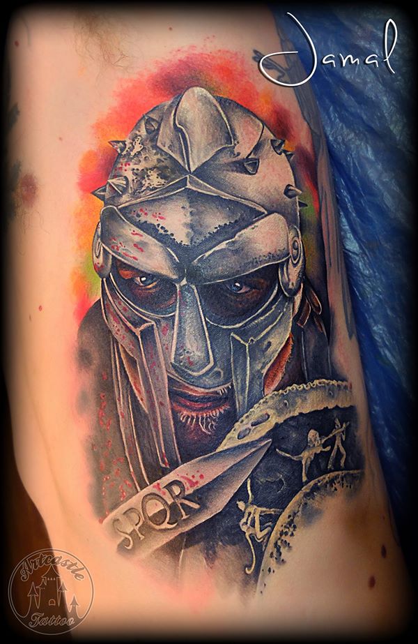 ArtCastleTattoo Tattoo ArtiestJamal Gladiator side piece with armor a blade and a shield. Also color effects in the background Color