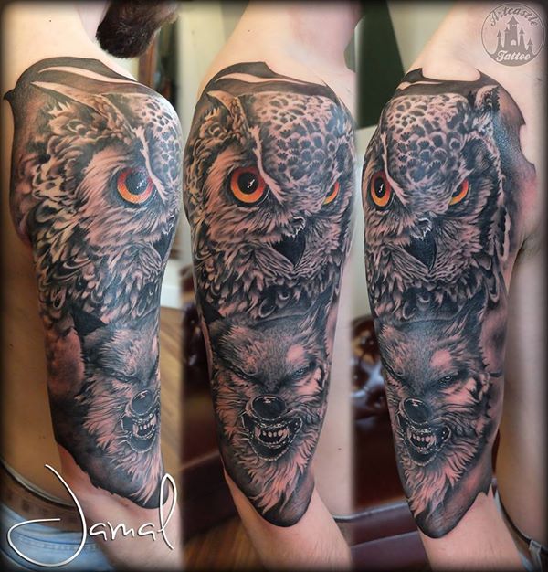 ArtCastleTattoo Tattoo ArtiestJamal Realistic Owl and Wolf half sleeve tattoo with colored eyes and Black n Grey