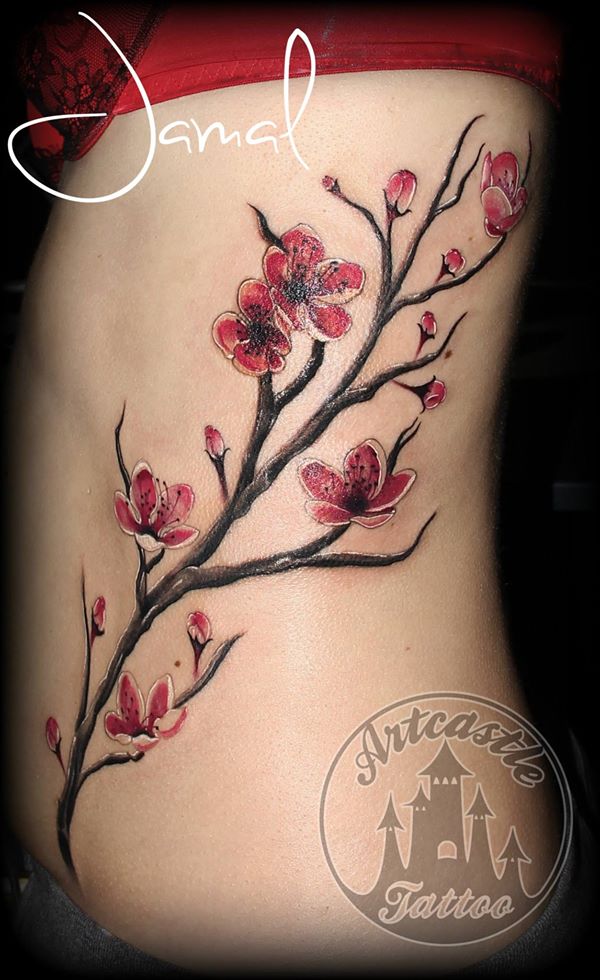 ArtCastleTattoo Tattoo ArtiestJamal Realistic color cherry blossom branch tattoo on side Kleur realistisch kersenbloesem tak tattoo op zij Color