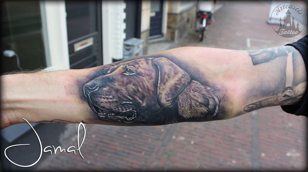ArtCastleTattoo Tattoo ArtiestJamal Realistic dog portrait in black n grey on the underarm Black n Grey