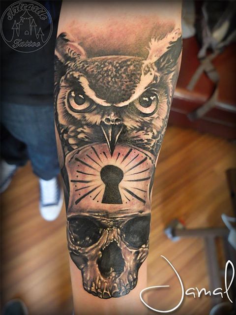 ArtCastleTattoo Tattoo ArtiestJamal Realistic owl tattoo with realistic skull and a keyhole Black n Grey