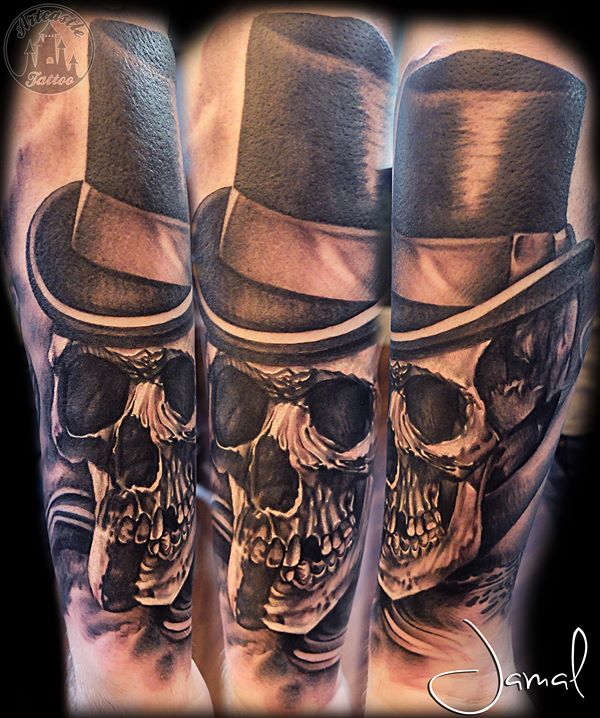 ArtCastleTattoo Tattoo ArtiestJamal Realistic skull on the underarm with a top hat Black n Grey