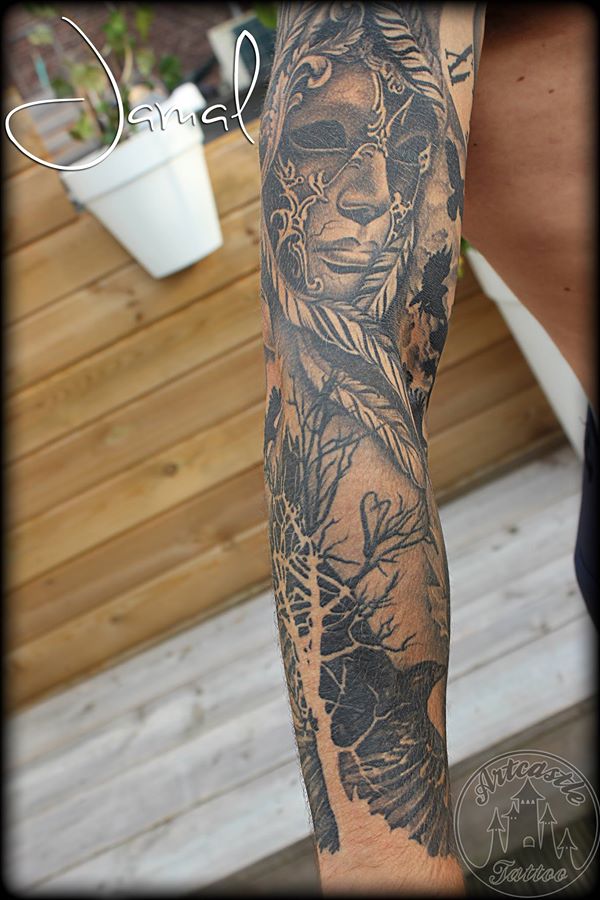ArtCastleTattoo Tattoo ArtiestJamal Surrealist realistic sleeve in black n grey with face trees and crows Sleeves