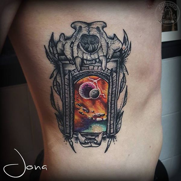 ArtCastleTattoo Tattoo ArtiestJona Blackwork doorway with skull and Galaxy in full color on ribs Color