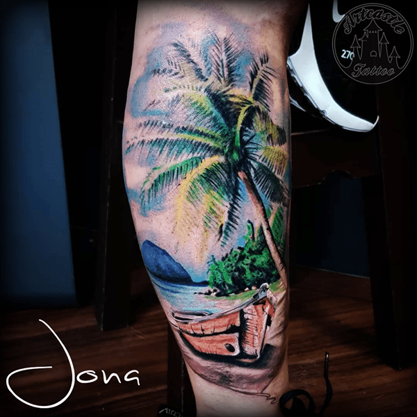 ArtCastleTattoo Tattoo ArtiestJona Realistic carribbean beach landscape tattoo with palm tree in full color lower leg Color