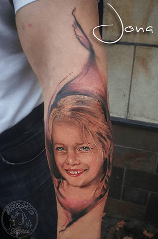 ArtCastleTattoo Tattoo ArtiestJona Realistic portrait of daughter on arm with lifelike colors Portrait