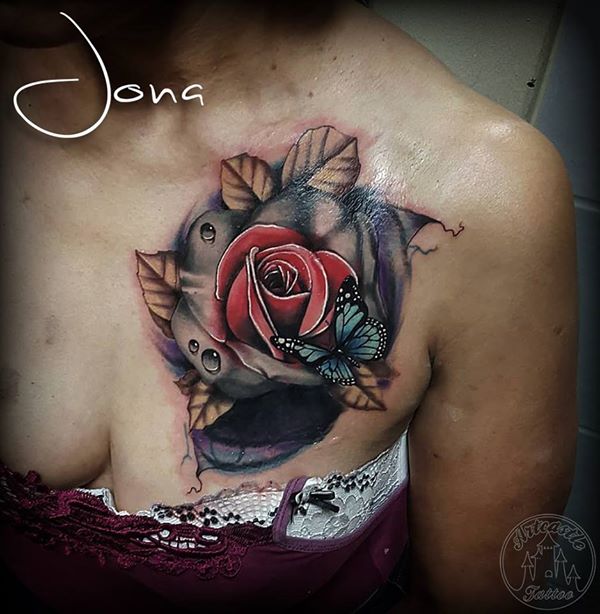 ArtCastleTattoo Tattoo ArtiestJona Realistic rose with blue butterfly used as a cover up on the chest. Color