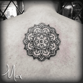 ArtCastleTattoo Tattoo ArtiestMax Blackwork flower mandala on upper back with dotwork shading and details Mandala