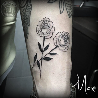 ArtCastleTattoo Tattoo ArtiestMax Blackwork roses with some dot shading and black leaves on the arm Blackwork
