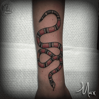 ArtCastleTattoo Tattoo ArtiestMax Gucci snake logo in colored dotwork on arm Dotwork