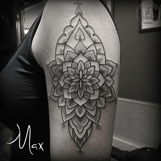 ArtCastleTattoo Tattoo ArtiestMax Large decorative mandala on the upper arm with clean lines and dotwork shading Mandala