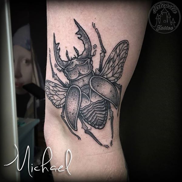 ArtCastleTattoo Tattoo ArtiestMichael Black n grey beetle tattoo on upper arm Blackwork