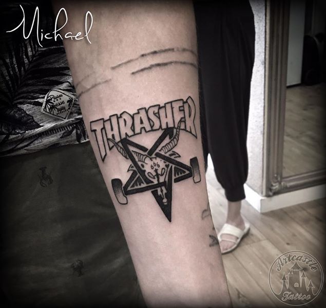 ArtCastleTattoo Tattoo ArtiestMichael Blackwork Thrasher logo tattoo on arm Old School