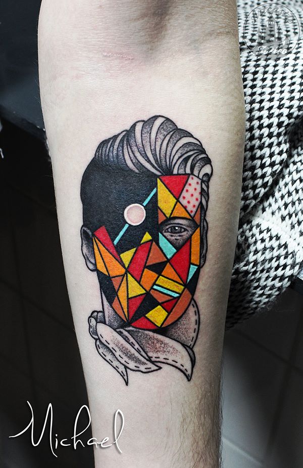 ArtCastleTattoo Tattoo ArtiestMichael Traditional face portrait with creative colored geometric shapes in the face and graphic design Old School