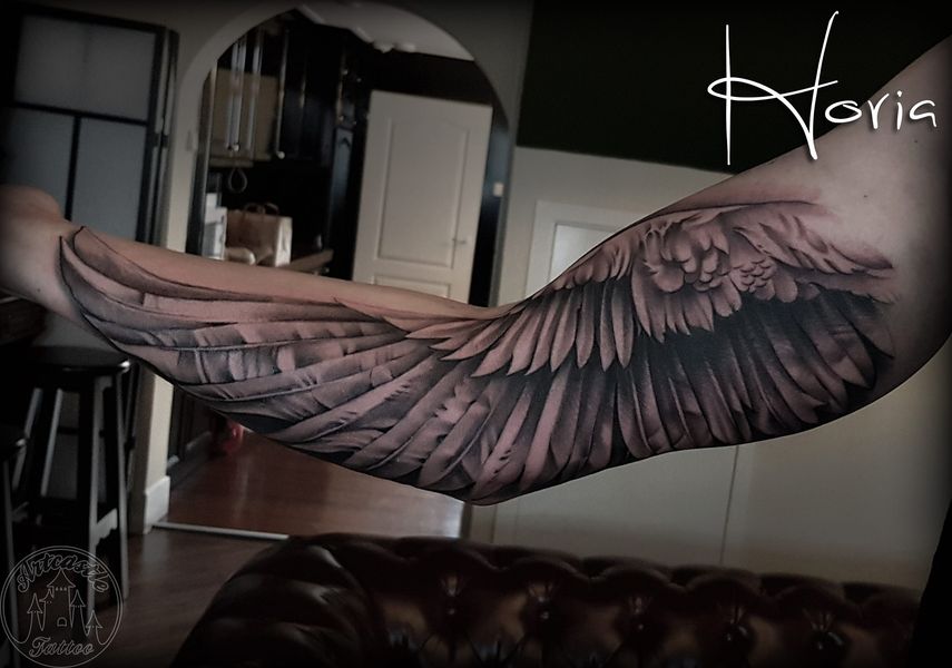 ArtCastleTattoo Tattoo ArtiestPrive Horia Realistic wing tattoo on inner arm Black n Grey