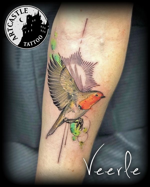 ArtCastleTattoo Tattoo ArtiestVeerle bird with linework and watercolor on lower arm Color