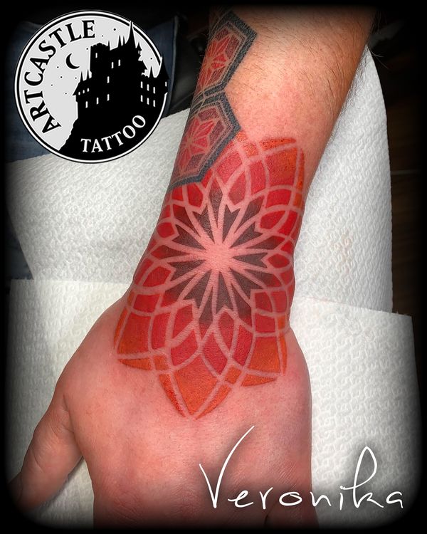 ArtCastleTattoo Tattoo ArtiestVeronika mandala in red tones on top of wrist Color