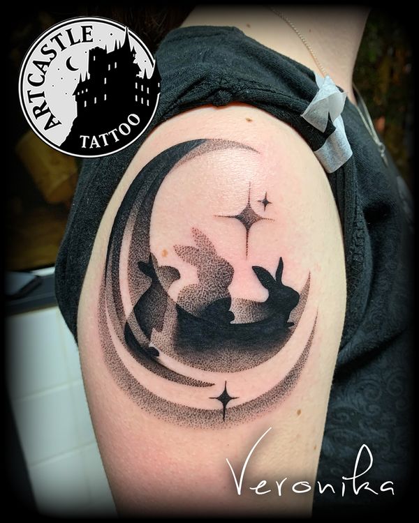 ArtCastleTattoo Tattoo ArtiestVeronika silhouette of three rabbits on a moon on shoulder Blackwork