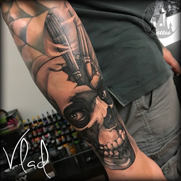 ArtCastleTattoo Tattoo ArtiestVlad Relaistic Skull with paint brushes tattoo lower arm Black n Grey